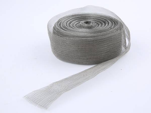A roll of tinned copper shielding mesh on gray background.