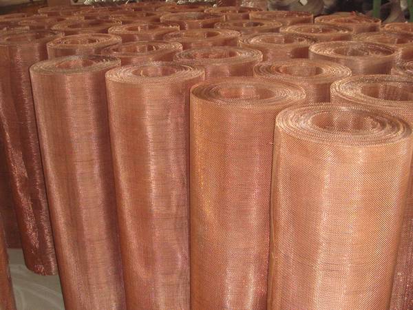 Several rolls of copper woven mesh in the warehouse.