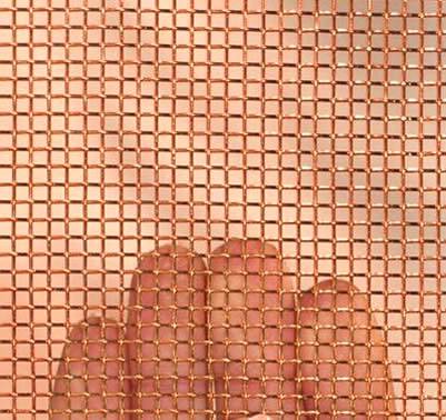 A piece of woven copper mesh on a woman's hand