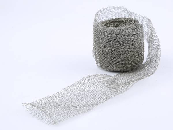 A roll of stainless steel shielding mesh on gray background.