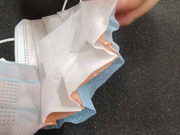 Three layers of non-woven melt-blown fabric and a layer of copper mesh insert.