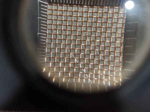 Mesh count of the copper wire mesh viewed through a fisheye type instrument