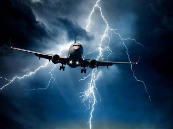Aircraft flies in lightning weather conditions.