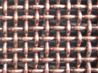 A detail of plain weave copper crimped mesh.